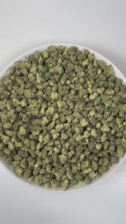 PUFFY Luxor (smalls) is an indica-dominant hybrid THCa strain, crafted from the unique union of Triangle Kush and SinMint Cookies. The aroma is a zesty burst of lime, layered with warm woody undertones and a subtle gassy note, creating a bold, energizing, and slightly earthy fragrance. Visually, dense deep green buds with purple hues and fiery orange pistils are coated in sticky trichomes. Consumers often report experiencing euphoria, an uplifted mood, heightened creativity, and a state of relaxed, focused 