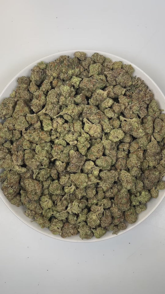 PUFFY Double Kush Cake is an indica-dominant hybrid THCa strain, born from a powerful cross between Hindu Kush, Afghani #1, and Skunk Kush. The aroma opens with rich, earthy notes of woody cedar, layered with a deep, musky undertone that lingers enticingly. Visually, dense green buds with purple hues and fiery orange pistils are coated in sticky trichomes. Consumers often report a deeply relaxing, full-body effect, accompanied by a gentle uplift in mood, providing soothing relief from anxiety, stress, occas