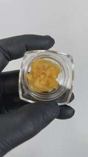 PUFFY THCa Angelica Badder: is a premium indica-dominant hybrid concentrate known for its smooth, creamy texture and rich terpene profile. This badder delivers a bold and flavorful experience, with a tropical fruit-forward aroma layered with notes of lemon, earthy hash, and a refreshing hint of menthol. Perfect for those seeking a potent, flavorful, and aromatic indulgence.
