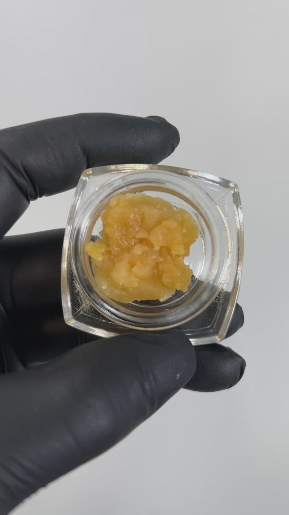 PUFFY THCa Angelica Badder: is a premium indica-dominant hybrid concentrate known for its smooth, creamy texture and rich terpene profile. This badder delivers a bold and flavorful experience, with a tropical fruit-forward aroma layered with notes of lemon, earthy hash, and a refreshing hint of menthol. Perfect for those seeking a potent, flavorful, and aromatic indulgence.
