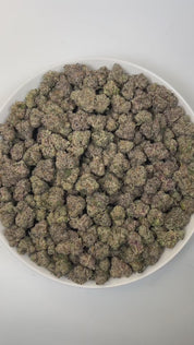 PUFFY Animal Cookies is an indica-dominant hybrid THCa strain, born from the renowned pairing of Girl Scout Cookies (GSC) with Fire OG. The aroma is rich and inviting, blending warm doughy notes with sweet cake and decadent chocolate undertones. Visually, dense green buds with purple hues and fiery orange pistils are coated in sticky trichomes. Consumers often report an initial sense of euphoria and uplifted mood, followed by deep relaxation and body calm, sometimes leading to sedation and full physical eas
