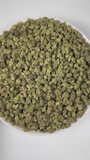 PUFFY Gelato (smalls) is a balanced hybrid THCa strain, created by crossing Sunset Sherbet and Thin Mint Girl Scout Cookies. The aroma combines bright citrus notes with smooth hints of vanilla and a grounding earthy undertone. Visually, the buds are dense and dark green with subtle purple hues, highlighted by bright orange pistils and a generous coating of frosty trichomes. Consumers often report a cerebral uplift and sense of euphoria, promoting an elevated mood, creativity, and sociability, accompanied by