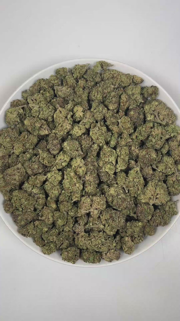 PUFFY Nightshade is an indica-dominant hybrid THCa strain, crafted from the legendary lineage of Kashmir × Nepalese landrace. The aroma is a bold and complex blend of woody undertones, sharp cheesy notes, and pungent gassy hints, creating a striking and memorable scent profile. Visually, dense dark green buds with purple hues and fiery orange pistils are coated in sticky trichomes. Consumers often report that this strain is deeply relaxing and calming, creating a soothing sense of comfort while delivering a