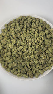 PUFFY Jelly Cake (smalls) is an indica-dominant hybrid THCa strain resulting from a masterful cross between Biscotti and Sunset Sherbet. The aroma is a luscious combination of creamy richness, ripe berries, and velvety vanilla. The buds are dense and chunky with deep green and purple hues, bright orange pistils, and a thick layer of sticky white trichomes. Consumers frequently describe a euphoric mental uplift that slowly transitions into soothing, full-body calm, often leaving them cheerful, mellow, and wi