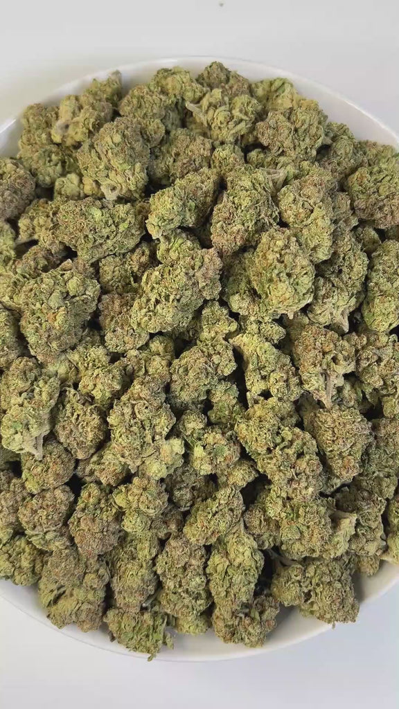 PUFFY Thin Mint is an indica-dominant hybrid THCa strain crafted from the flavorful cross of Durban Poison and OG Kush. The aroma is a rich blend of spicy, earthy, and musky notes, creating a warm and intoxicating scent that lingers in the air. Visually striking, the dense buds blend forest green and royal purple with fiery orange pistils and a frosty layer of trichomes that hint at potent effects. Consumers often describe an experience that begins with euphoric, mentally stimulating effects, boosting mood 