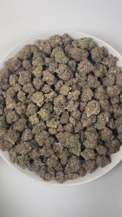 PUFFY Zereal is a well-balanced hybrid THCa strain born from the flavorful cross of Cereal Milk and ZKZ. The aroma bursts with bright citrus notes, sweet vanilla, and a bold, gassy punch. Visually, the buds are dense and vibrant, displaying rich green and deep purple hues, accented by bright orange pistils and a sparkling coat of trichomes. Consumers often report fast-acting effects that start with an immediate cerebral uplift, followed by waves of euphoria, happiness, and an energizing boost that sparks cr