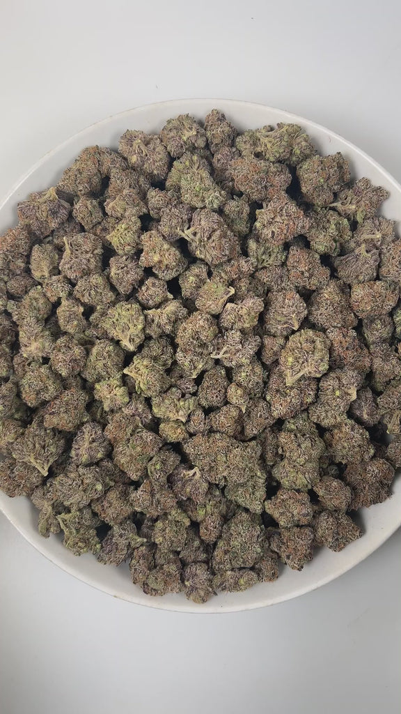 PUFFY Zereal is a well-balanced hybrid THCa strain born from the flavorful cross of Cereal Milk and ZKZ. The aroma bursts with bright citrus notes, sweet vanilla, and a bold, gassy punch. Visually, the buds are dense and vibrant, displaying rich green and deep purple hues, accented by bright orange pistils and a sparkling coat of trichomes. Consumers often report fast-acting effects that start with an immediate cerebral uplift, followed by waves of euphoria, happiness, and an energizing boost that sparks cr