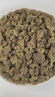 PUFFY Dip N Stix is a sativa-dominant hybrid THCa strain, expertly crafted from a potent cross between Platinum Cookies x Slurricane. Aroma is a harmonious blend of earthy and herbal notes, brightened with fresh citrus undertones and a subtle sweet finish, creating a rich and inviting scent profile. Visually, the buds are dense and chunky with emerald and purple hues, fiery orange pistils, and a frosty trichome coating. Consumers describe the experience as energizing, euphoric, and mood-lifting, often spark