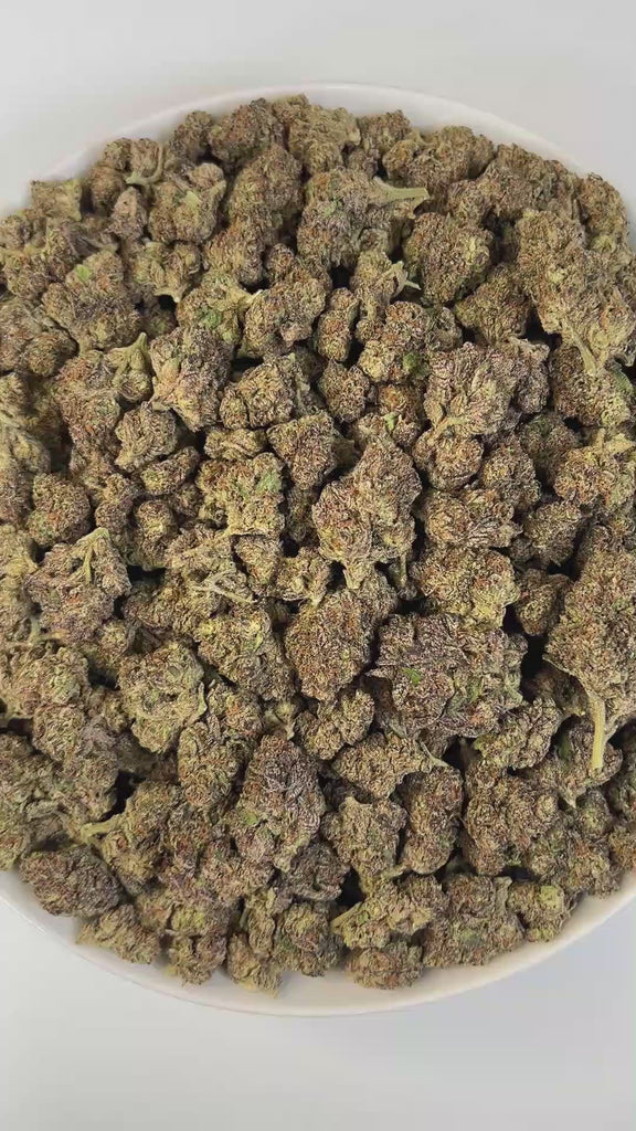 PUFFY Dip N Stix is a sativa-dominant hybrid THCa strain, expertly crafted from a potent cross between Platinum Cookies x Slurricane. Aroma is a harmonious blend of earthy and herbal notes, brightened with fresh citrus undertones and a subtle sweet finish, creating a rich and inviting scent profile. Visually, the buds are dense and chunky with emerald and purple hues, fiery orange pistils, and a frosty trichome coating. Consumers describe the experience as energizing, euphoric, and mood-lifting, often spark