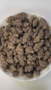 PUFFY Halle Berry is a sativa-dominant THCa hybrid, expertly crafted from a cross between Ice Cream Cake and Blockberry. The aroma blends vibrant oranges, sharp diesel, and smooth cream into a bold yet indulgent scent.  Visually, the buds are fluffy and diamond-shaped, showcasing a striking mix of mint-green to deep purple hues, accented by vibrant orange pistils and a thick coating of frosty trichomes. Consumers often describe an initial surge of euphoria, enhanced focus, and increased sociability and talk