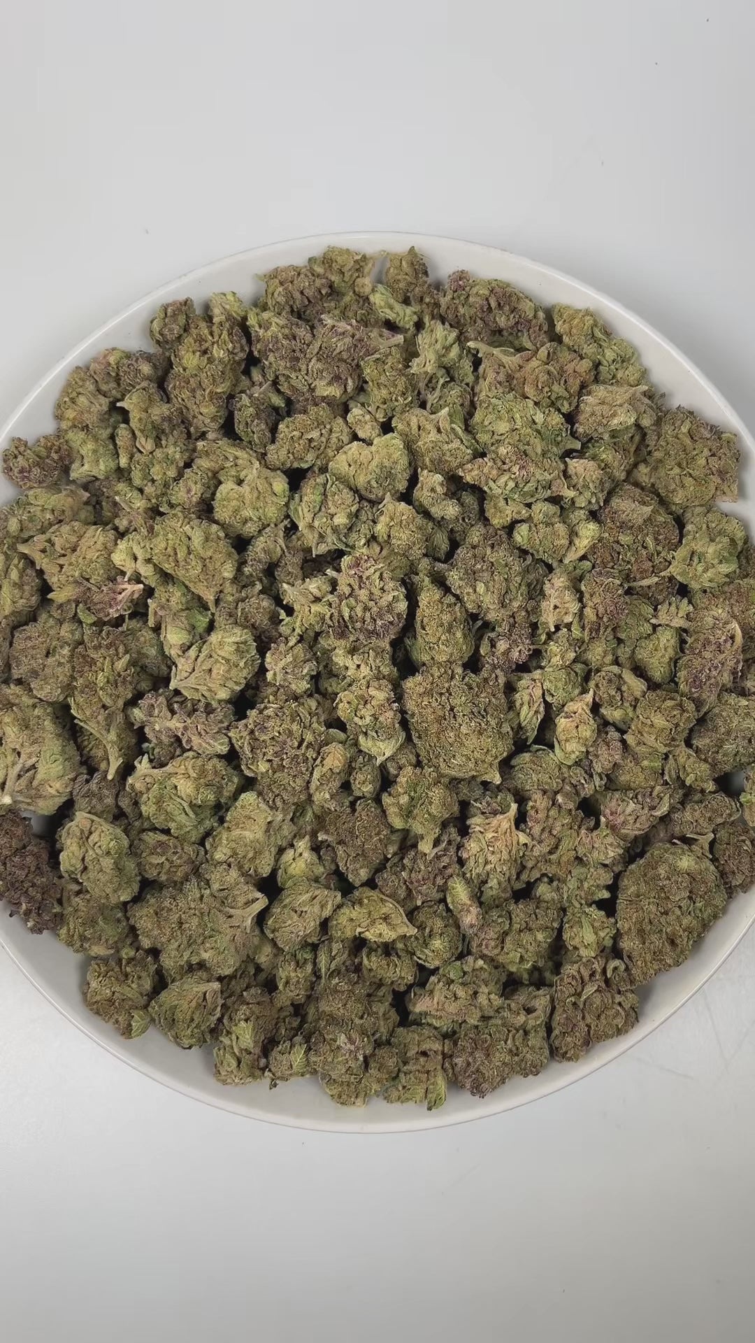 PUFFY Fruity Pebbles is an indica-dominant hybrid THCa strain, born from the intricate cross of Green Ribbon × Granddaddy Purple x Tahoe Alien. The aroma of this strain is a captivating blend of fruity sweetness, subtle licorice notes, and warm, aromatic spices, creating a complex and inviting scent profile that entices the senses. Visually, dense green buds with purple hues and fiery orange pistils are coated in sticky trichomes. Consumers often report a blissful blend of happiness and euphoria, feeling up