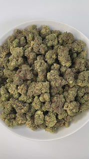 PUFFY Watermelon is an indica-dominant hybrid THCa strain, bred from the renowned cross of Watermelon x Kush genetics. The aroma bursts with sweet candy notes layered with juicy watermelon and a hint of ripe cherries, creating a playful and mouthwatering profile. Visually, the buds are thick and well-formed, showcasing dark green tones with streaks of purple, fiery orange pistils, and a sparkling coat of trichomes. Consumers often describe a calming, full-bodied high that lifts the mood while easing tension
