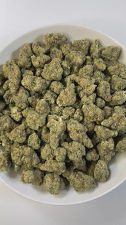 PUFFY Blue Dream is a sativa-dominant hybrid THCa strain born from the legendary cross between Blueberry and Haze. The aroma bursts with a rich blend of fruity sweetness layered with ripe berries, underscored by a bold skunky finish that adds depth and complexity. Visually stunning, its dense, bright green buds are accented by deep blue hues, fiery orange pistils, and a generous dusting of icy trichomes making it as eye-catching as it is effective. Consumers often report a euphoric, uplifting head high that