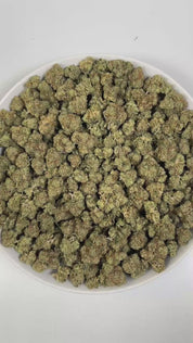 PUFFY Holy Grail OG is an indica-dominant hybrid THCa strain, born from the renowned fusion of Kosher Kush and OG Kush #18. The aroma opens with bright, zesty citrus notes, layered with a bold, pungent edge and a warm, lingering spiciness. Visually, dense green buds with hints of purple are threaded with fiery orange pistils and coated in a sparkling layer of sticky trichomes. Consumers often report a calming body relaxation paired with euphoric uplift, happy and mellow moods, and occasional bursts of creat