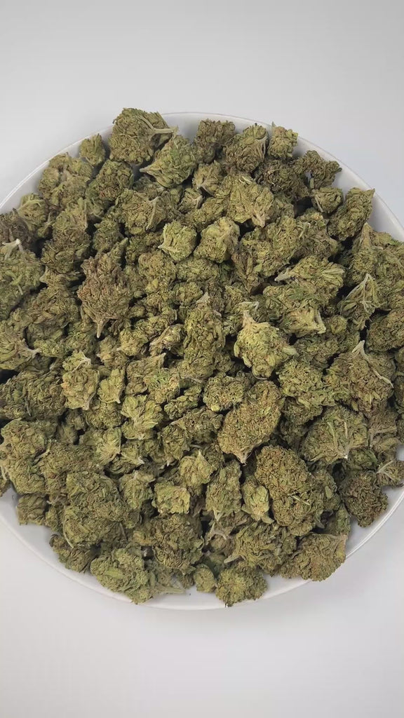 PUFFY Blue Dream is a sativa-dominant hybrid THCa strain born from the legendary cross between Blueberry and Haze. The aroma combines sweet berry and zesty citrus notes with a bold hint of diesel, creating a vibrant and memorable scent. Visually stunning, its dense, bright green buds are accented by deep blue hues, fiery orange pistils, and a generous dusting of icy trichomes making it as eye-catching as it is effective. Consumers often report a euphoric, uplifting head high that flows into a gentle, motiva