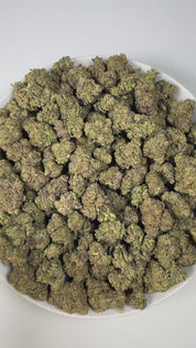 PUFFY Blue Lobster is a balanced hybrid THCa strain, born from the flavorful cross between Apples & Bananas and Eye Candy. The aroma combines rich earthy tones with sweet blueberry accents and a deep, gassy finish. Visually, the buds are dense and vibrant, displaying a mix of green with striking blue and purple hues, accented by bright orange pistils and a generous coating of glistening trichomes. Consumers often describe an uplifting, euphoric cerebral rush that enhances mood, focus, and creativity, gradua