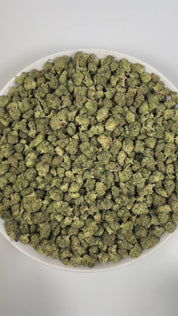 PUFFY Jokerz Candy (smalls) is an indica-dominant hybrid THCa strain, born from the flavorful cross between Gummiez and Grape Gasoline. The aroma bursts with bold grape notes layered over a gassy kick and a fresh, piney finish. Visually, the dense buds display forest-green tones with deep purple hues, vibrant orange pistils, and a frosty trichome coating. Consumers often describe the effects as euphoric and uplifting, promoting happiness and mental clarity, followed by a wave of deep relaxation.