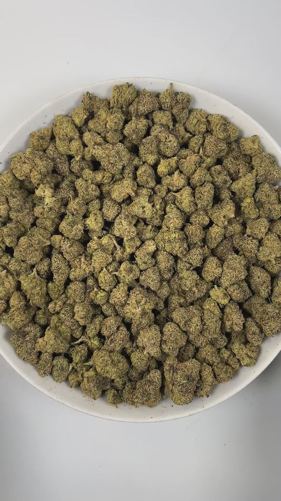 PUFFY Kiwi Strawberry is a sativa-dominant  hybrid THCa strain, most reliable sources note that its exact lineage remains largely unverified. The aroma unfolds with sweet strawberry notes, layered with delicate floral undertones and a subtle earthy richness. Visually, dense forest green buds with purple hues and fiery orange pistils are coated in sticky trichomes. Consumers often report an uplifting, energizing cerebral buzz that sparks euphoria and sociability, promoting chatty, inspired, and creative mood