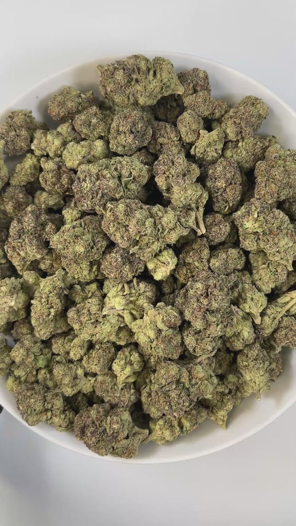 PUFFY Grape Sundae is a well-balanced hybrid THCa strain born from the flavorful cross of Sundae Driver and Grape Pie Bx. The aroma unfolds with sweet cake notes layered with smooth vanilla and a subtle hint of ripe grape, creating a rich and indulgent profile. Visually, the buds are stunning showcasing deep violet and emerald green hues, generously coated in a frosty layer of trichomes. Consumers often report a euphoric uplift paired with enhanced creativity and focus, followed by a soothing body relaxatio