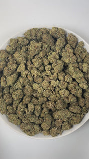 PUFFY Jokerz Candy is an indica-dominant hybrid THCa strain, born from the flavorful cross between Gummiez and Grape Gasoline. The aroma delights the senses with a sweet candy-like fragrance, layered with earthy undertones and subtle floral notes. Visually, the dense buds display forest-green tones with deep purple hues, vibrant orange pistils, and a frosty trichome coating. Consumers often describe the effects as euphoric and uplifting, promoting happiness and mental clarity, followed by a wave of deep rel