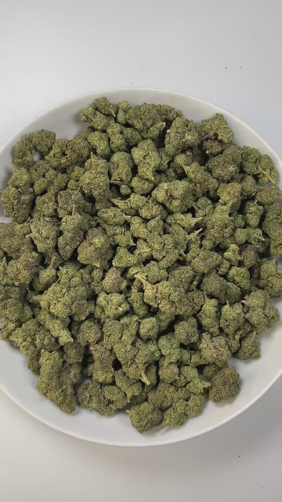 PUFFY Cartel Cut is an indica-dominant hybrid THCa strain, created by crossing Chemdog and Purple Urkle. The aroma carries a soothing blend of fresh herbal notes layered with creamy sweetness and a subtle woody finish. Visually, the buds are dense and deep green, accented with subtle purple hues, bright orange pistils, and a thick layer of frosty trichomes. Consumers often report a fast-hitting cerebral high that melts into full-body relaxation, making it popular for easing stress, lifting mood, and promoti