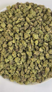 PUFFY Cookie Crumble Smalls is an indica-dominant hybrid THCa strain, expertly crafted from a flavorful cross between Cherry Pie and Girl Scout Cookies. The aroma is richly sweet and fruity, layered with creamy, nutty undertones that evoke the scent of freshly baked cookies with a hint of berry. Visually, the buds are dense and chunky with emerald and purple hues, bright orange pistils, and a frosty trichome coating that gives a sugary, cookie-like appearance. Consumers frequently describe an initial wave o