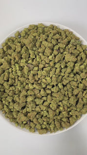 PUFFY Super Silver Haze (smalls) is a sativa-dominant hybrid THCa strain, expertly crafted from a flavorful and legendary three-way cross of Skunk #1, Northern Lights, and Haze. The aroma is a bold blend of funky, refreshing eucalyptus, and sharp diesel notes that immediately capture the senses. Visually, the buds are spade-shaped with a bright lime green hue, accented by fiery orange pistils and coated in a dense layer of silvery-white trichomes. Consumers often describe feeling a surge of energy, heighten