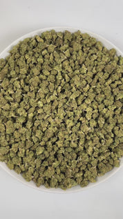 PUFFY Gelato #41 (smalls) is an indica-dominant hybrid THCa strain, expertly crafted from a potent cross between Sunset Sherbet and Thin Mint Cookies. The aroma is a bold blend of sharp chemicals, zesty citrus, and pungent gassy notes, creating a striking and memorable scent profile. Visually, buds are dense and frosty, featuring deep green and purple hues with bright orange pistils and a thick coating of sparkling trichomes. Consumers often report an uplifting euphoria that energizes the mind, boosts creat