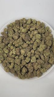 PUFFY Bolato is an indica-dominant hybrid THCa strain, expertly crafted from a premium blend of Curelato, Runtz, and Lemon Cherry Gelato. The aroma is a rich blend of herbal, woody, and smokey notes, creating a deep, earthy scent that lingers pleasantly in the air. Visually, dense green buds with purple hues and fiery orange pistils are coated in sticky trichomes. Consumers often report a euphoric and deeply relaxing experience that helps reduce stress while potentially easing both anxiety and physical disc