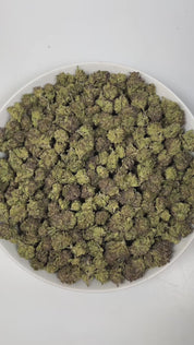PUFFY Black Caviar is an indica-dominant hybrid THCa strain, born from the legendary cross of Fire OG and The Black. The aroma is a delightful blend of creamy and sweet notes, beautifully complemented by a subtle hint of lavender. Visually, the buds are dense and vibrant green with purple hues, accented by orange pistils and coated in a thick layer of sticky, crystal-like trichomes. Consumers often report a strong, uplifting cerebral buzz that gradually melts into deep physical relaxation, easing tension an