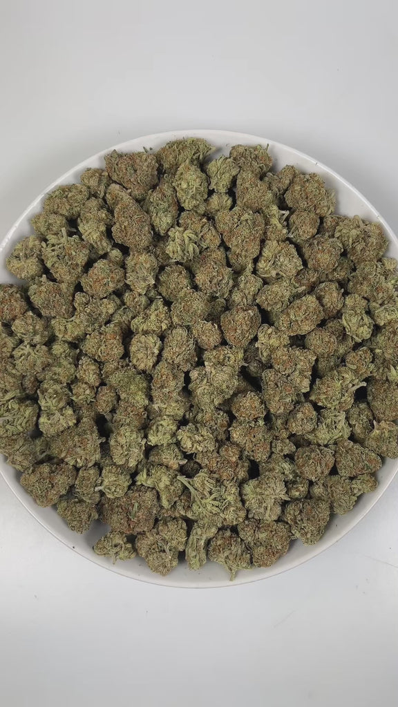 PUFFY Grape Gasoline is a balanced hybrid THCa strain, created from the fusion of Jet Fuel Gelato and Grape Pie. The aroma is a rich blend of earthy notes layered with herbal tones and a hint of warm spice. Visually, it shows deep violet tones with green leaves, orange pistils, and a sparkling coat of trichomes. Consumers often report a stimulating, blissful high that ignites creativity while a gentle body relaxation eases stress and enhances focus, ideal for social moments or creative pursuits.