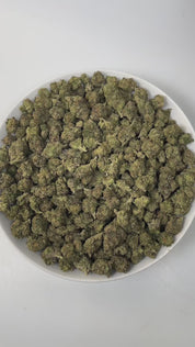 PUFFY Lemon Cherry Gelato is an indica-dominant  hybrid THCa strain, expertly crafted from a potent cross between Sunset Sherbet and Girl Scout Cookies. The aroma is a delightful blend of cherry, sweet, and creamy notes, creating an inviting and luscious scent that instantly captivates the senses. Visually, buds are dense and frosty, featuring deep green and purple hues with bright orange pistils and a thick coating of sparkling trichomes. Consumers often report an initial wave of uplifted, happy euphoria, 