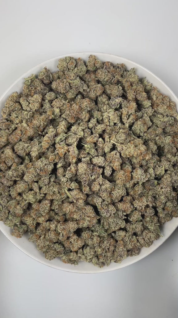 PUFFY Blueberry Muffin is an indica-dominant hybrid THCa strain, crafted by crossing the renowned Blueberry with Purple Panty Dropper. The aroma bursts with vibrant fruity notes, accented by a sweet, candy-like essence and lively, zesty highlights that create an invigorating and uplifting scent. Visually, the buds are dense, with rich green and purple tones, bright orange pistils, and a frosty layer of trichomes. Consumers often report a euphoric, uplifting experience that gently elevates mood, eases tensio